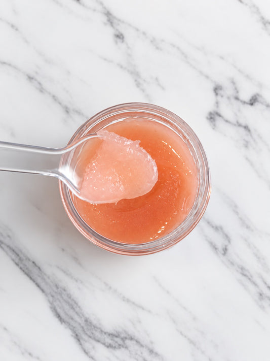 Strawberry Lip Scrub texture on a spoon — pink sugar scrub